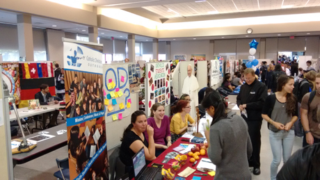 lots of booths set up and people visiting them at club days